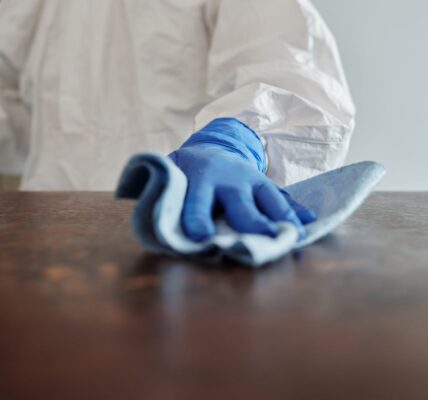 close up photo of person cleaning the table